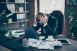 © deagreez - Photo of helpless business guy crumple papers holding head hands need rest work day night workaholic tired powerless wear black blazer shirt suit sitting chair office indoors