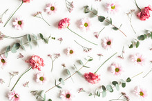 Flowers Composition. Pattern Made Of Pink Flowers And Eucalyptus Branches On White Background. Valentines Day, Mothers Day, Womens Day Concept. Flat Lay, Top View
