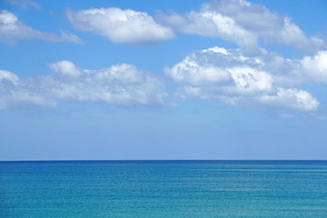 Nature seascape of Clouds blue sky and blue sea at Mai Khao beach near Phuket airport  thailand - Blue nature backdrop background with copy space text