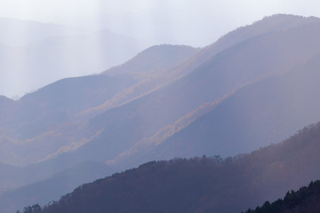 Tanzawa Ranges cascades with dramatic sunbeams autumn sunset.