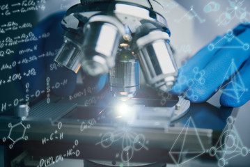 Wall Mural - close-up shot of microscope with metal lens.
