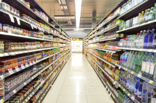 Cuadros en Lienzo Blurred Background Abstract Bokeh Shelving unit in Shopping store supermarket look at the lights