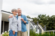 © LIGHTFIELD STUDIOS - mature man holding keys of new house and hugging smiling woman