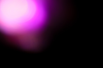 Canvas Print - purple flare on a black background. light for design