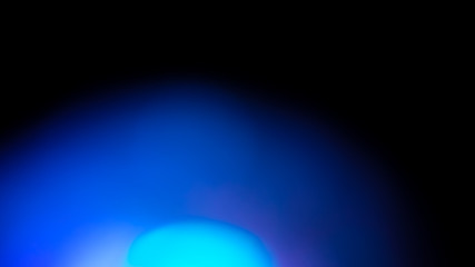 Wall Mural - blue flare on a black background. beautiful light for design