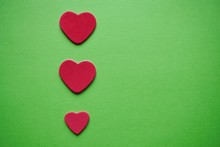 Red Hearts Decoration On The Green Background For Valentine's Day, Romantic Background