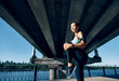 © GVS - Sporty woman runner stretching legs for warming up before exercising