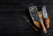 Old Butcher Meat Knife, Cleaver And Fork On Black Background