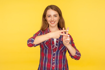 Wall Mural - Viral web content. Portrait of cheerful attractive ginger girl in casual shirt showing hash sign, hashtag hand gesture, popular topic, recommendation on internet. indoor studio shot, yellow background