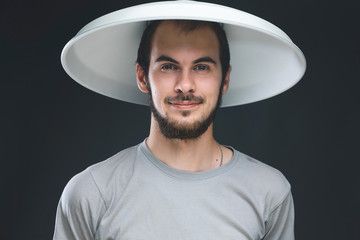 smilinh man with metal hat