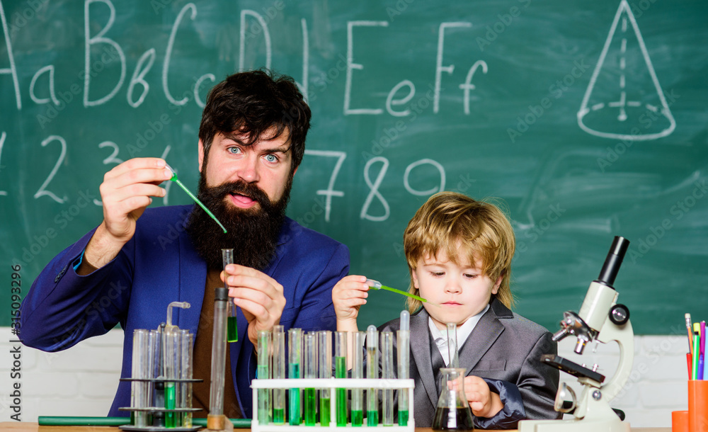 Scientist research and experiments father and son at school. learning ...