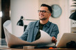 © JustLife - Young businessman working on project. Handsome architect in office.
