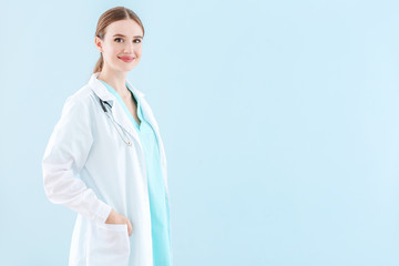 Wall Mural - Portrait of female doctor on light background