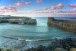 © David Henderson/Caia Image - Idyllic seascape view beyond jetty Craster  Northumberland UK