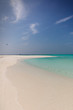 © Tom Merton/Caia Image - Tranquil tropical ocean beach under sunny blue sky