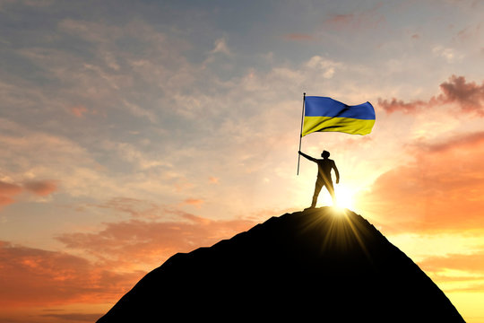 Ukraine flag being waved at the top of a mountain summit. 3D Rendering