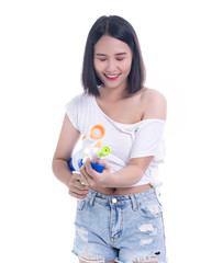 Smiling beautiful Asian girl holding plastic water gun at Songkran festival, Thailand. Modern Beauty fashion women short hair wear White t-shirt happy in Thai ceremony Isolated on white background