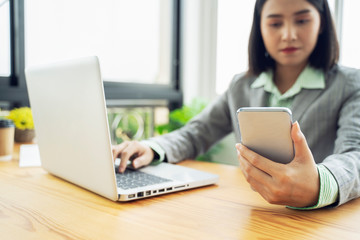Contact us,businesswoman work by modern devices, she uses digital tablet computer ,mobile smartphone for New marketing plan researching mobile phone,email, telephone ,e-mail address wifi icon concept