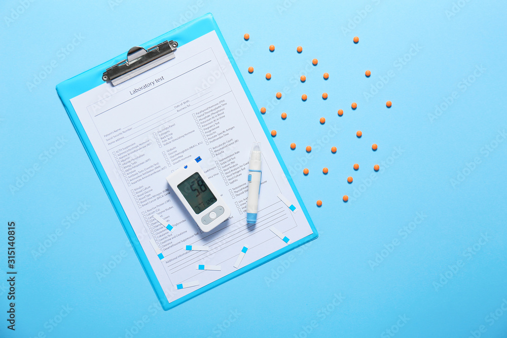 Laboratory test, glucometer, pills and lancet pen on color background. Diabetes concept