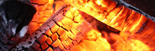 Close-up Of Burning Log In Bonfire. Large Orange Flame From Fire With Woods. Light And Ash From Wood In Balefire. Amazing Campfire With Dark View Outdoor