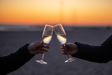 Man And Woman With Glass Of Wine At Sunset
