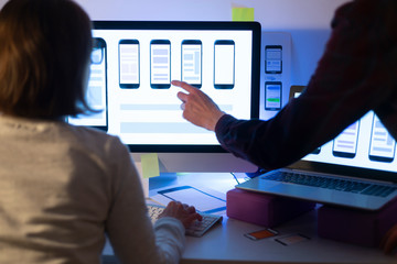 designers create a user interface for mobile phones. website development. user experience.