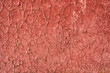Cracked red paint with rust. Seamless old texture background