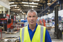 Portrait Confident Worker In Steel Factory