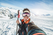 Skier Man Is Taking A Selfie On A Snowy Mountain At Winter
