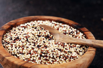 Set of quinoa Red, white and brown quinoa in a wooden spoon. healthy food