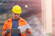 © Rafal Rodzoch/Caia Image - Steel worker reviewing blueprints in factory