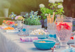 © Robert Daly/Caia Image - Strawberry water and desserts on garden party patio table