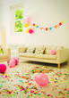 © Robert Daly/Caia Image - Birthday sign, balloons and confetti in living room