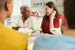 © Robert Daly/Caia Image - Smiling women enjoying party at table