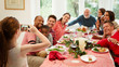© Robert Daly/Caia Image - Girl camera phone photographing multi-ethnic family at Christmas dinner table