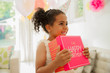 © Robert Daly/Caia Image - Eager girl holding birthday gift