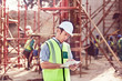 © Trevor Adeline/Caia Image - Construction worker using digital tablet at construction site