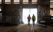 © Agnieszka Olek/Caia Image - Steel workers walking in factory