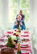 © Robert Daly/Caia Image - Portrait smiling multi-ethnic senior couple at Christmas dinner table