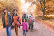 © Robert Daly/Caia Image - Multi-generation family walking on path in autumn park