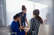 © Sam Edwards/Caia Image - Business people talking, working in conference room meeting