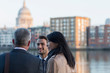 © Martin Barraud/Caia Image - Business people talking at urban waterfront, London, UK