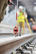 © Agnieszka Olek/Caia Image - Engineers surveying tracks at construction site