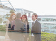 © Martin Barraud/Caia Image - Business people talking on office balcony