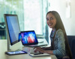 © Robert Daly/Caia Image - Portrait smiling, confident girl student programming at computer in classroom