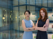 © Martin Barraud/Caia Image - Portrait confident businesswomen in modern office atrium
