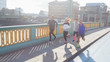 © Martin Barraud/Caia Image - Runners running on sunny urban bridge