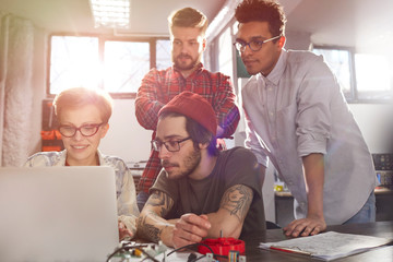 Designers working at laptop