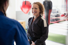 Smiling Women Practicing Judo In Gym