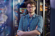 © Agnieszka Olek/Caia Image - Portrait confident male IT technician in server room